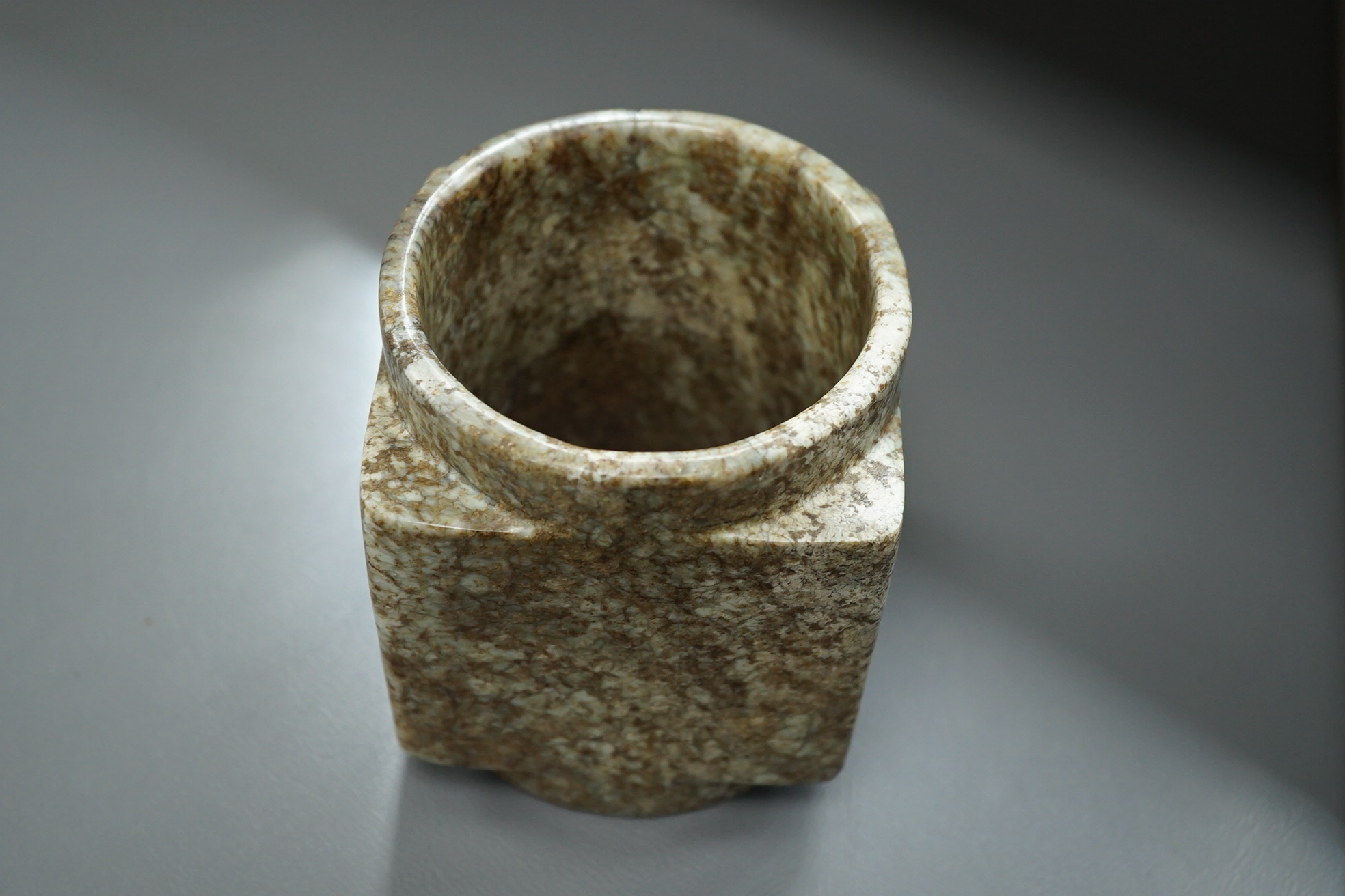 Four Chinese archaistic jade or hardstone cong
